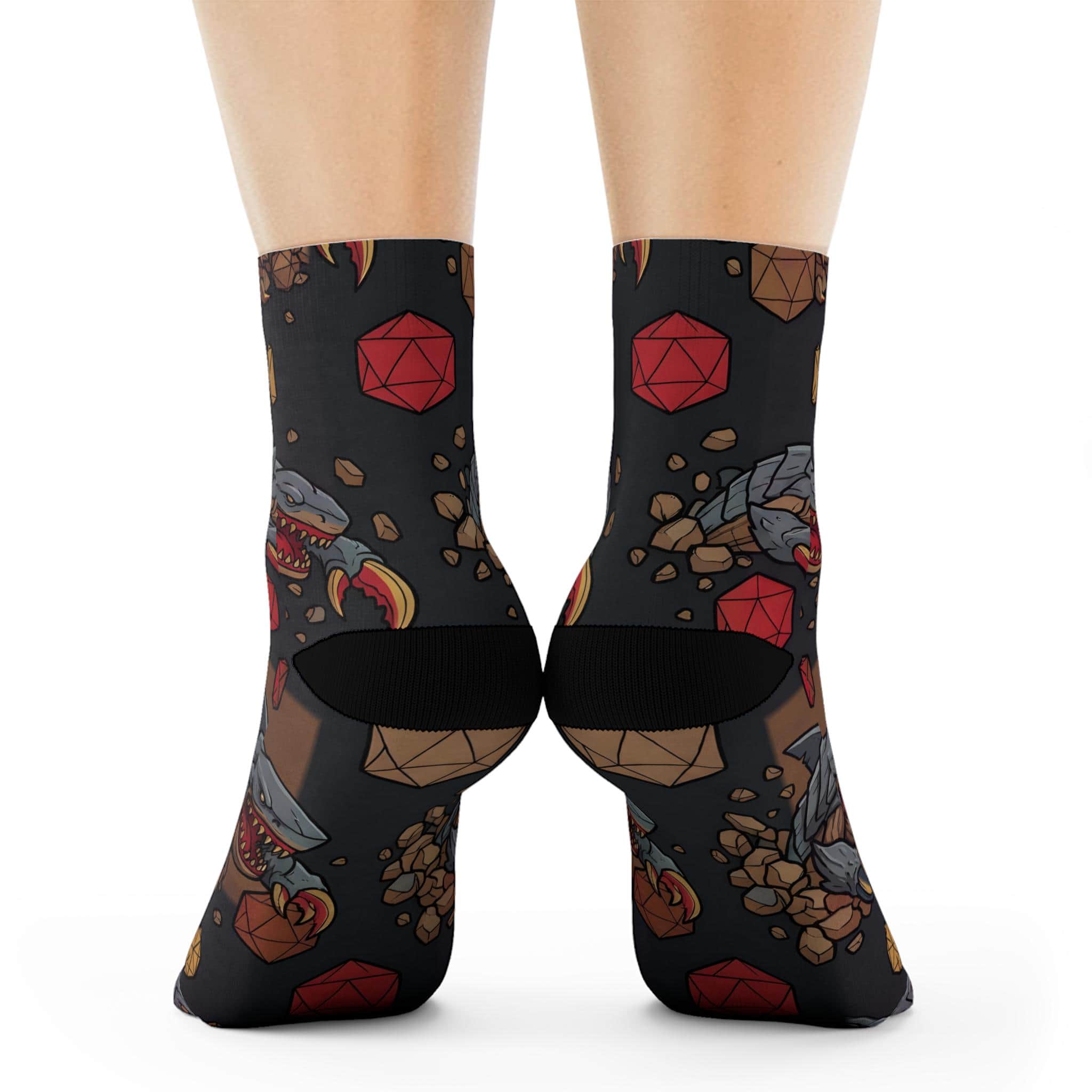 Photo 5 of 6: Humorous, combat-ready TTRPG crew socks featuring the notorious 'landshark' monster ambushing d20 dice in a seamless pattern, back view