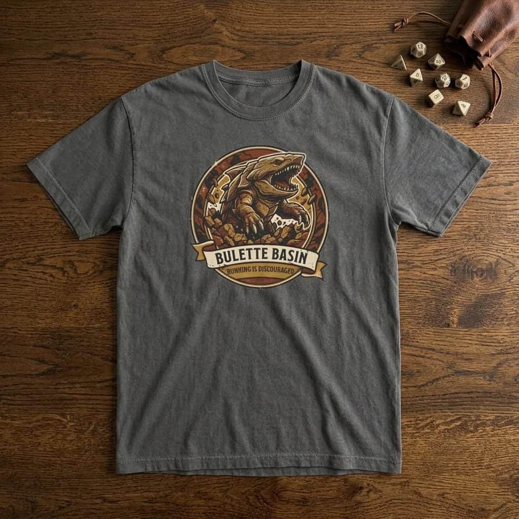 Photo 7 of 15: Vintage national park souvenir graphic tee featuring tabletop gaming's armored landshark burrower, paired with deadpan trail advice warning adventurers that running only draws its tremorsense, shown laid flat among dice