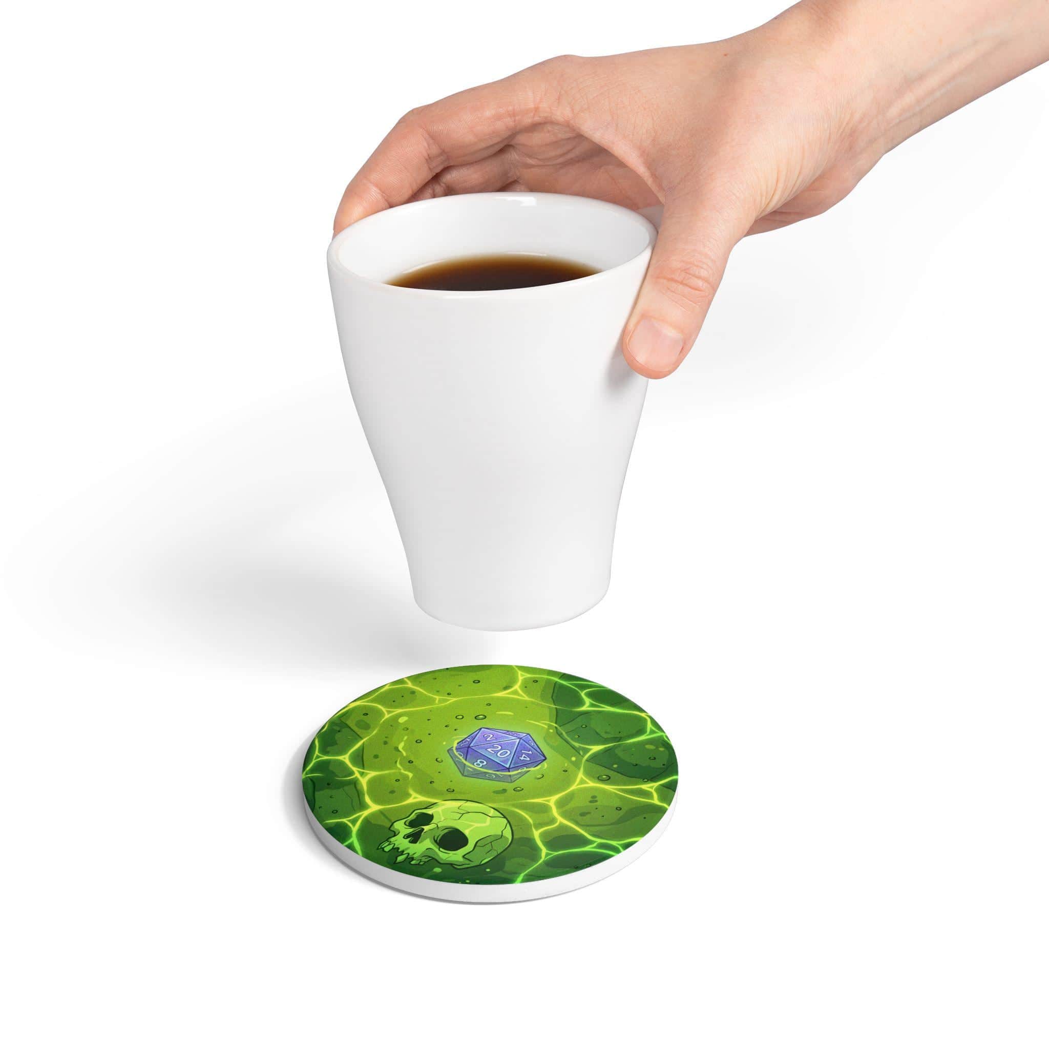 Photo 8 of 11: A square high-gloss drink coaster designed to look like a direct top-down view into a translucent acidic gelatinous cube trapping sunken dice and adventurer bones, serving as a witty spill hazard for campaign nights, in a room setting