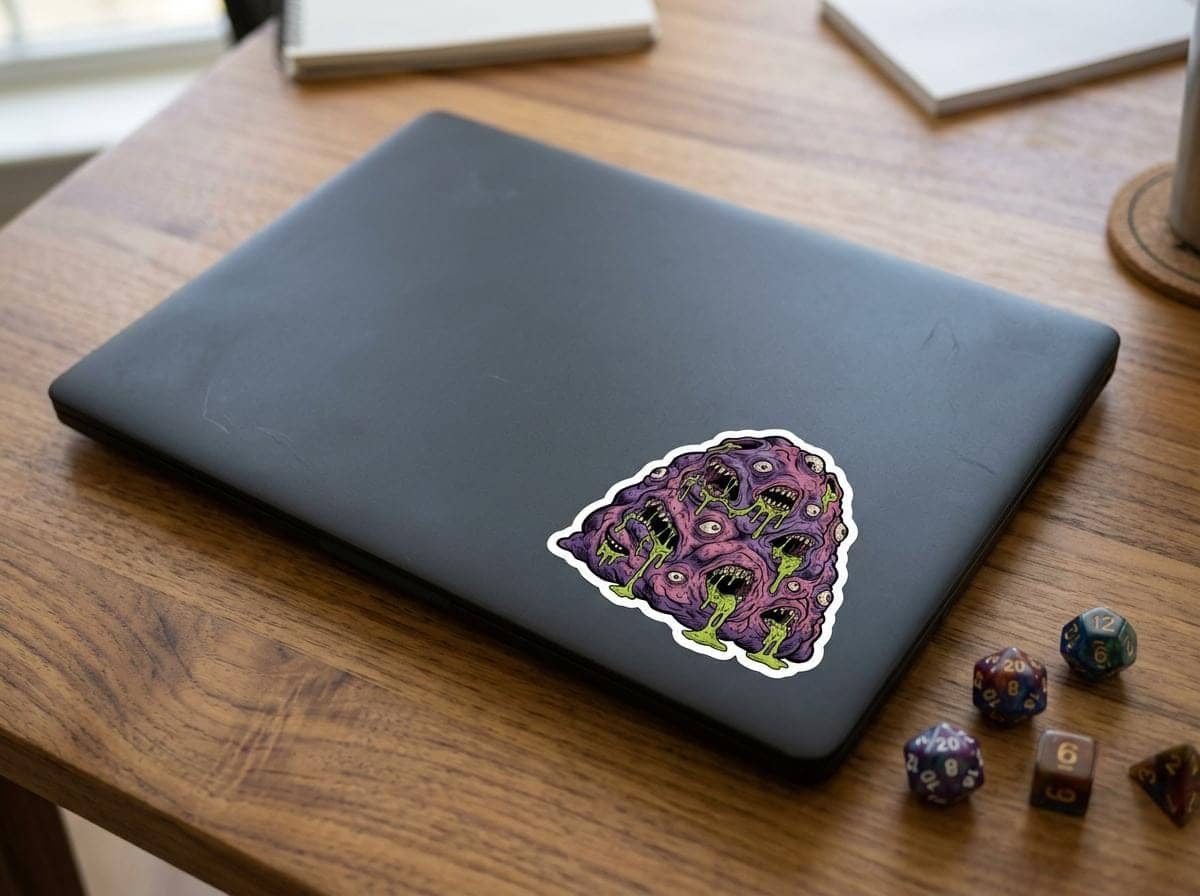 A grotesque aberrant monster sticker engineered for Dungeon Masters and eldritch horror enthusiasts personalizing laptops and hydro flasks, shown on a laptop lid