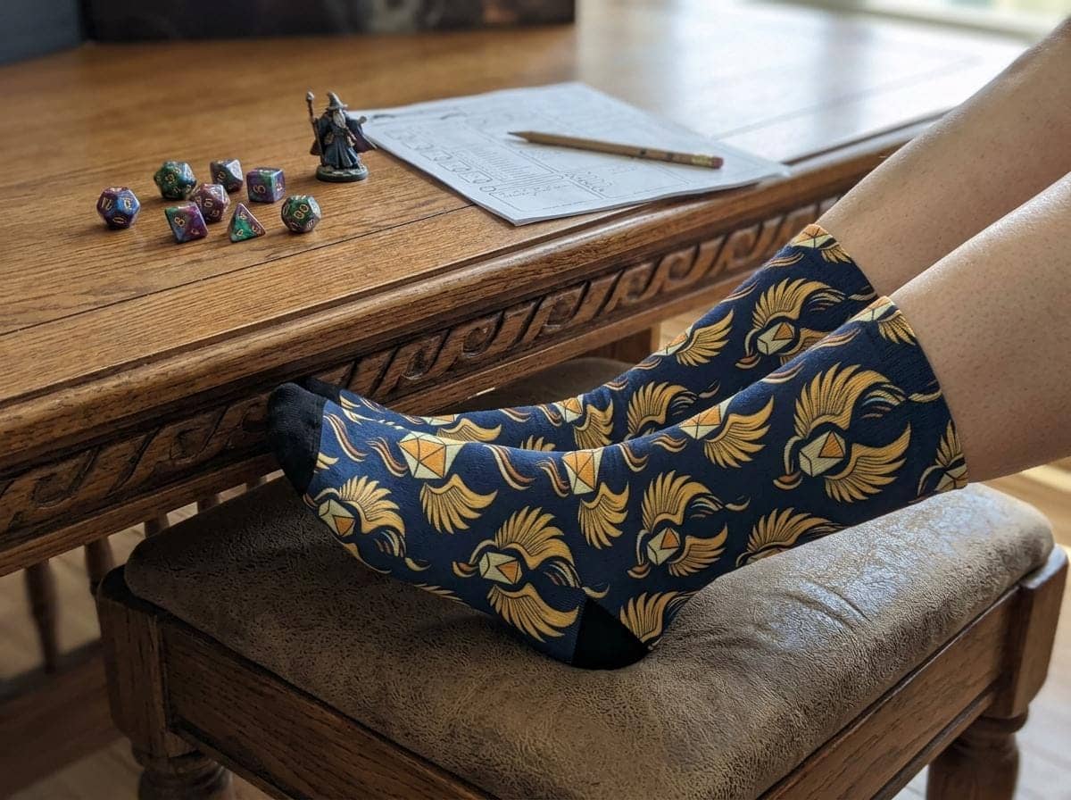 Turn every tabletop session into an action surge with crew socks designed to make the wearer's feet look like the legendary Boots of Speed, shown with feet up beside the game table