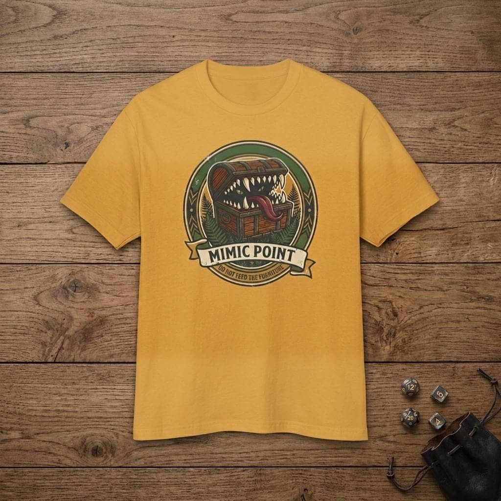 Deadpan national park badge tee warning dungeon adventurers against hungry furniture, shown laid flat among dice