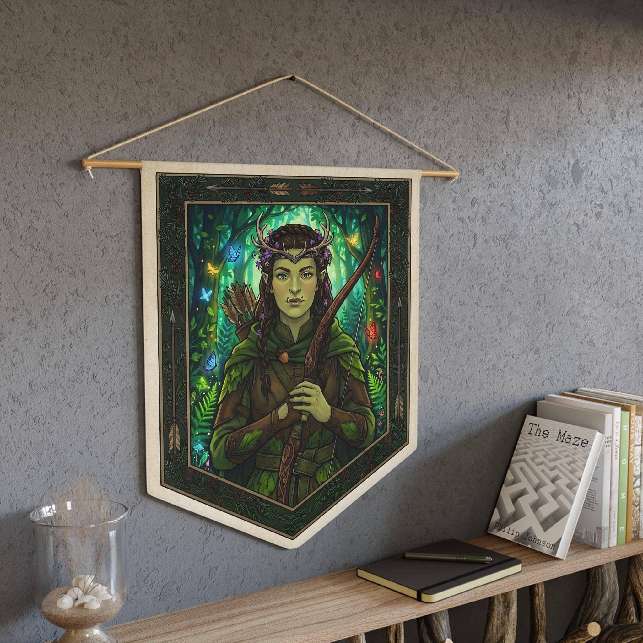 Subverts brutal half-orc tropes with enchanting Feywild cottagecore charm, printed on a pennant, in a room setting